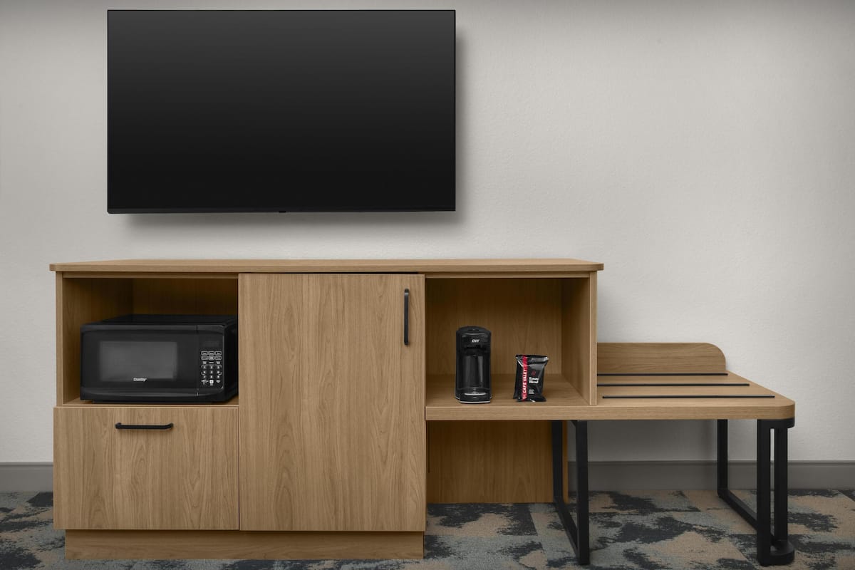 Premium bedding, desk, laptop workspace, blackout curtains