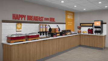 Ein Frühstücksbereich mit einem Schild, auf dem steht: 'HAPPY BREAKFAST STARTS HERE'.
