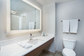 A modern bathroom with a white sink, mirror, and toilet. - Holiday Inn Express & Suites Lebanon-Nashville Area by IHG (Lebanon)
