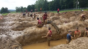 A muddy outdoor area with people engaged in a mud-related activity. - Holiday Inn Express & Suites Lebanon-Nashville Area by IHG (Lebanon)