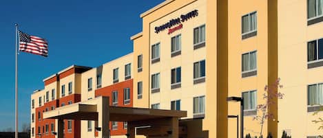 A hotel with a modern design, multiple floors, and a clear entrance.