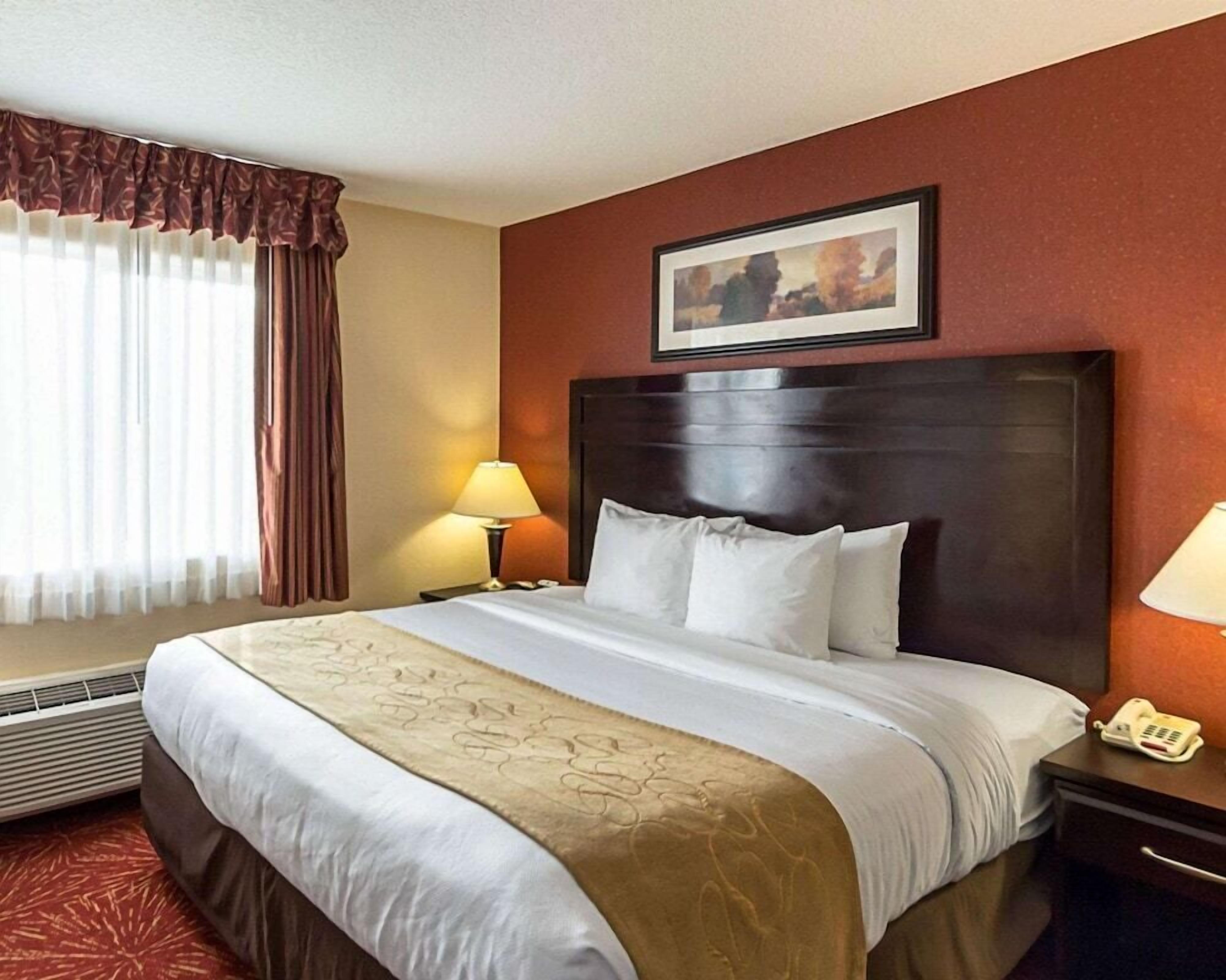 Desk, blackout curtains, iron/ironing board, bed sheets