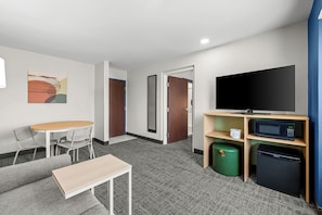 Suite, 2 Queen Beds | Desk, laptop workspace, blackout drapes, iron/ironing board
