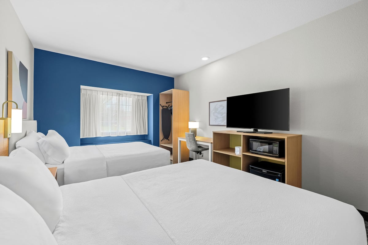 Desk, laptop workspace, blackout curtains, iron/ironing board