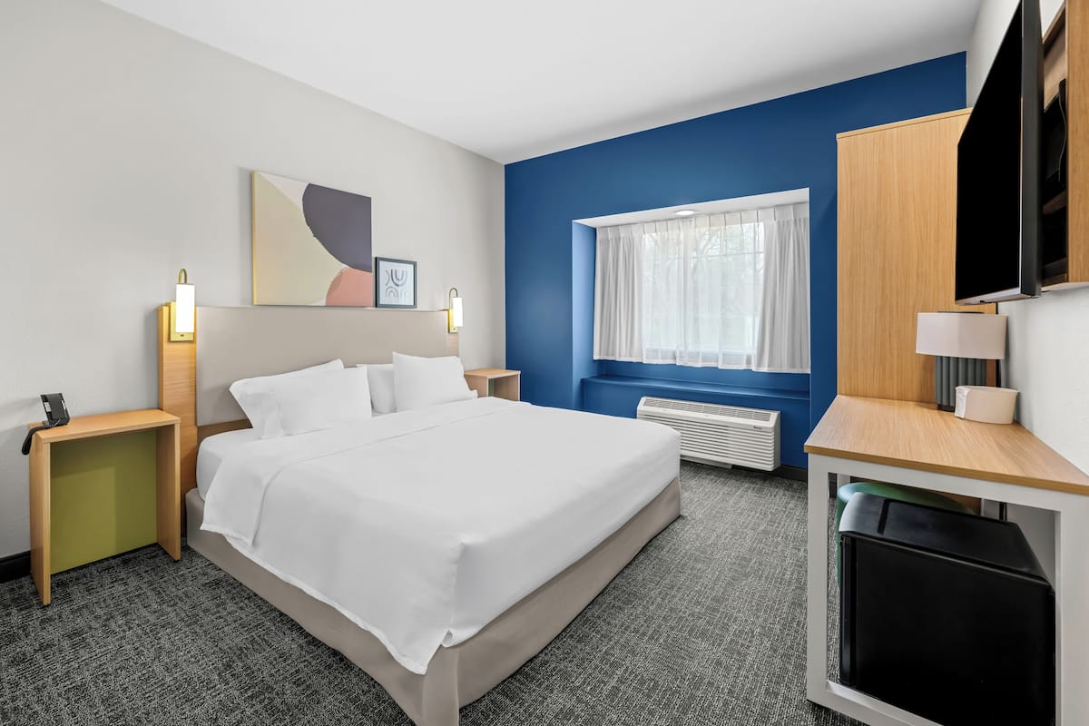 Desk, laptop workspace, blackout curtains, iron/ironing board