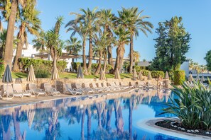 Indoor pool, seasonal outdoor pool, pool umbrellas, pool loungers