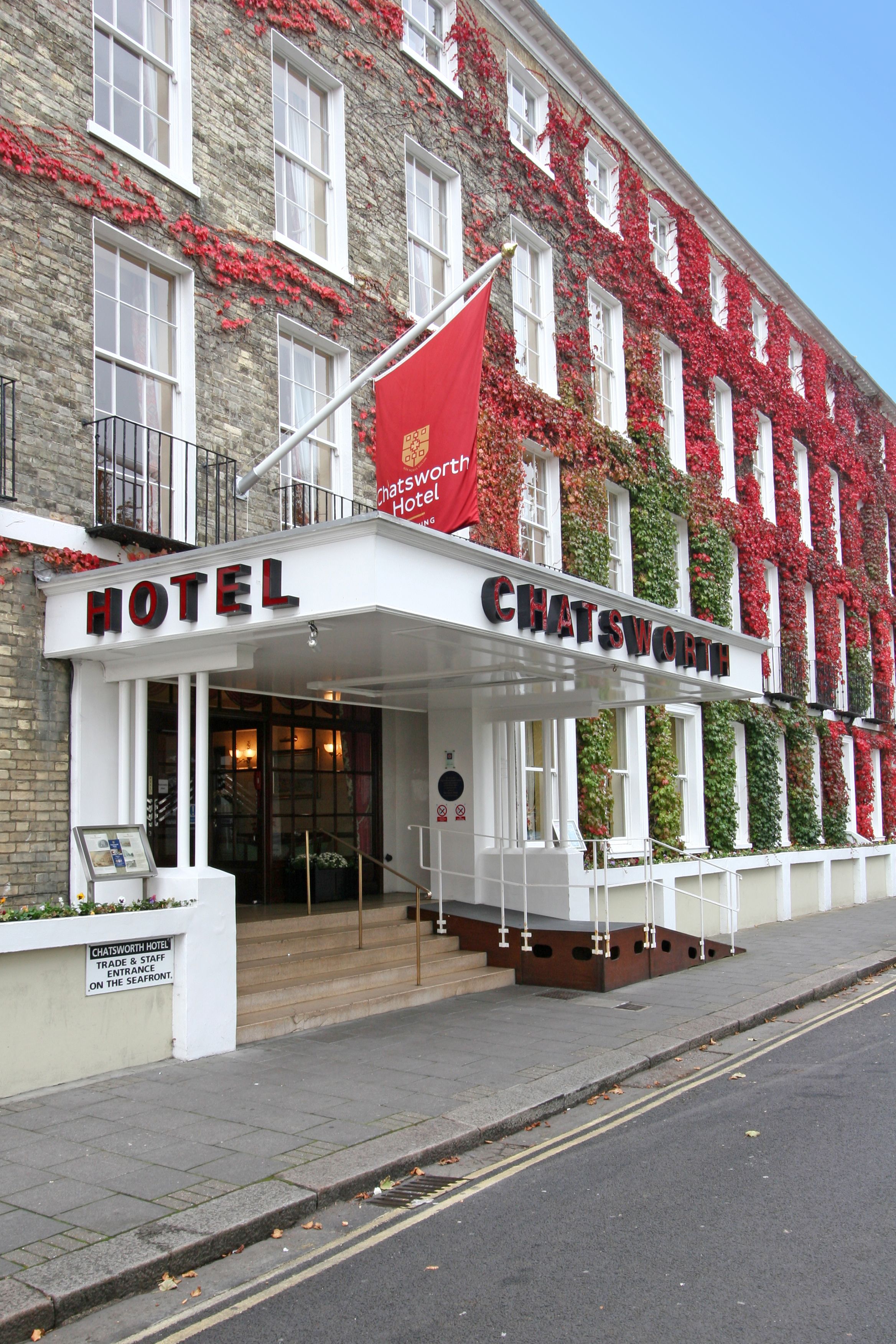 A hotel entrance with a sign reading "CHATSWORTH HOTEL".