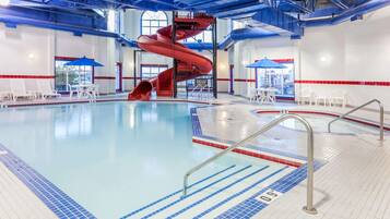 Relax by the pool with a thrilling water slide and comfortable lounge seating.