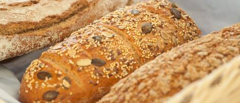 A variety of breads with seeds and nuts.