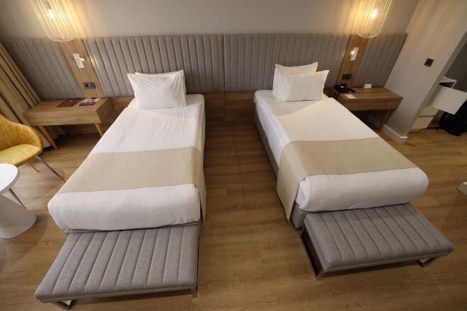 Premium bedding, in-room safe, blackout curtains, soundproofing