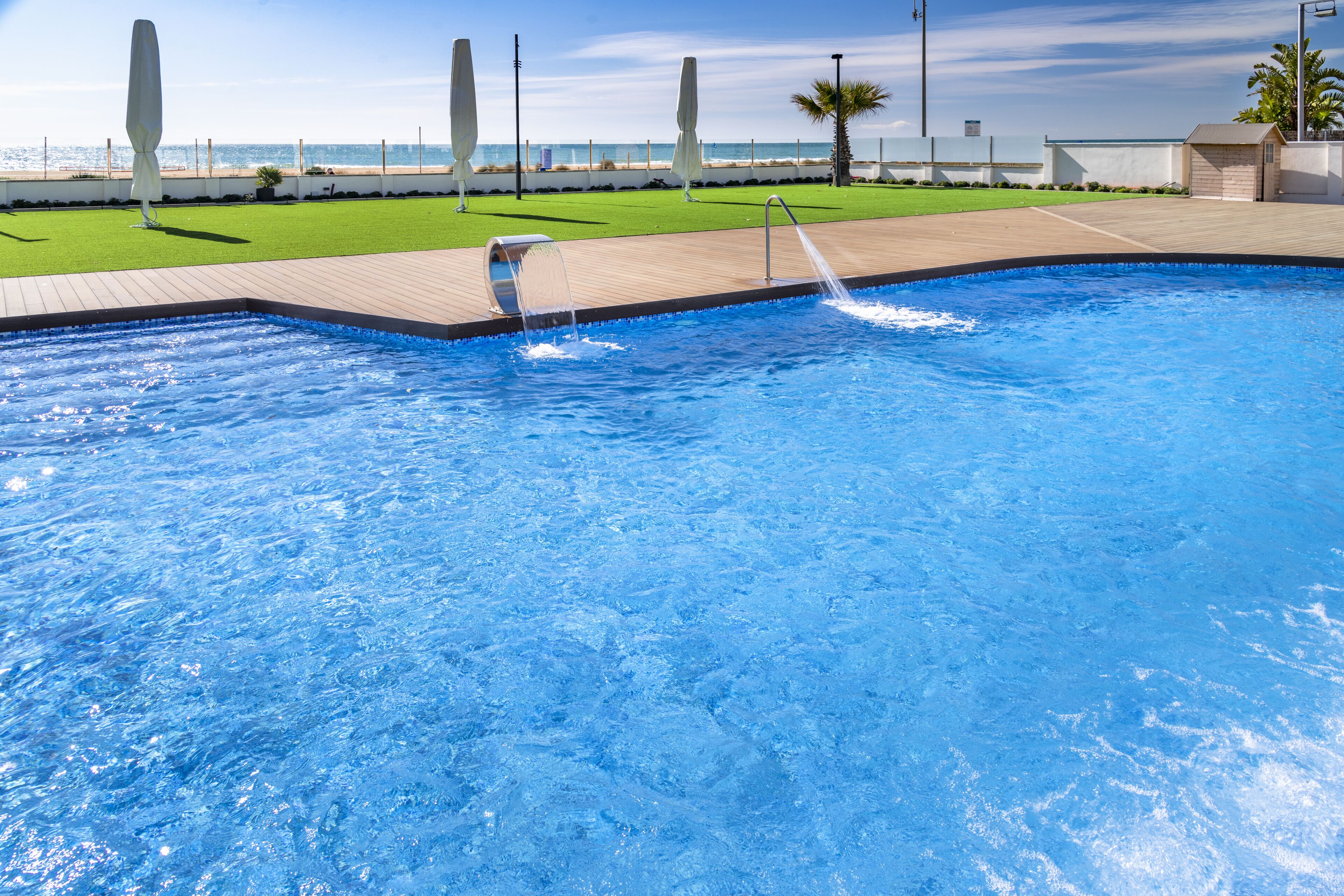 outdoor pool, pool umbrellas, pool loungers