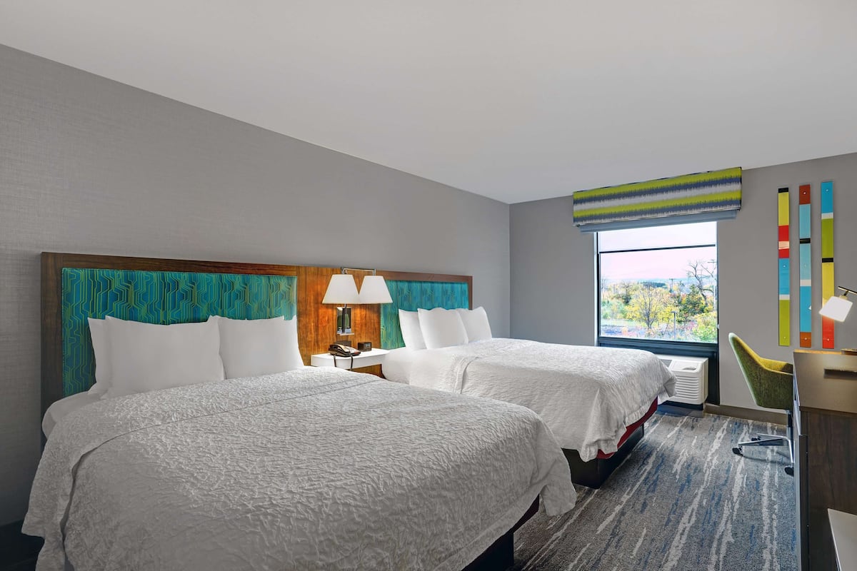 Premium bedding, pillow-top beds, desk, laptop workspace