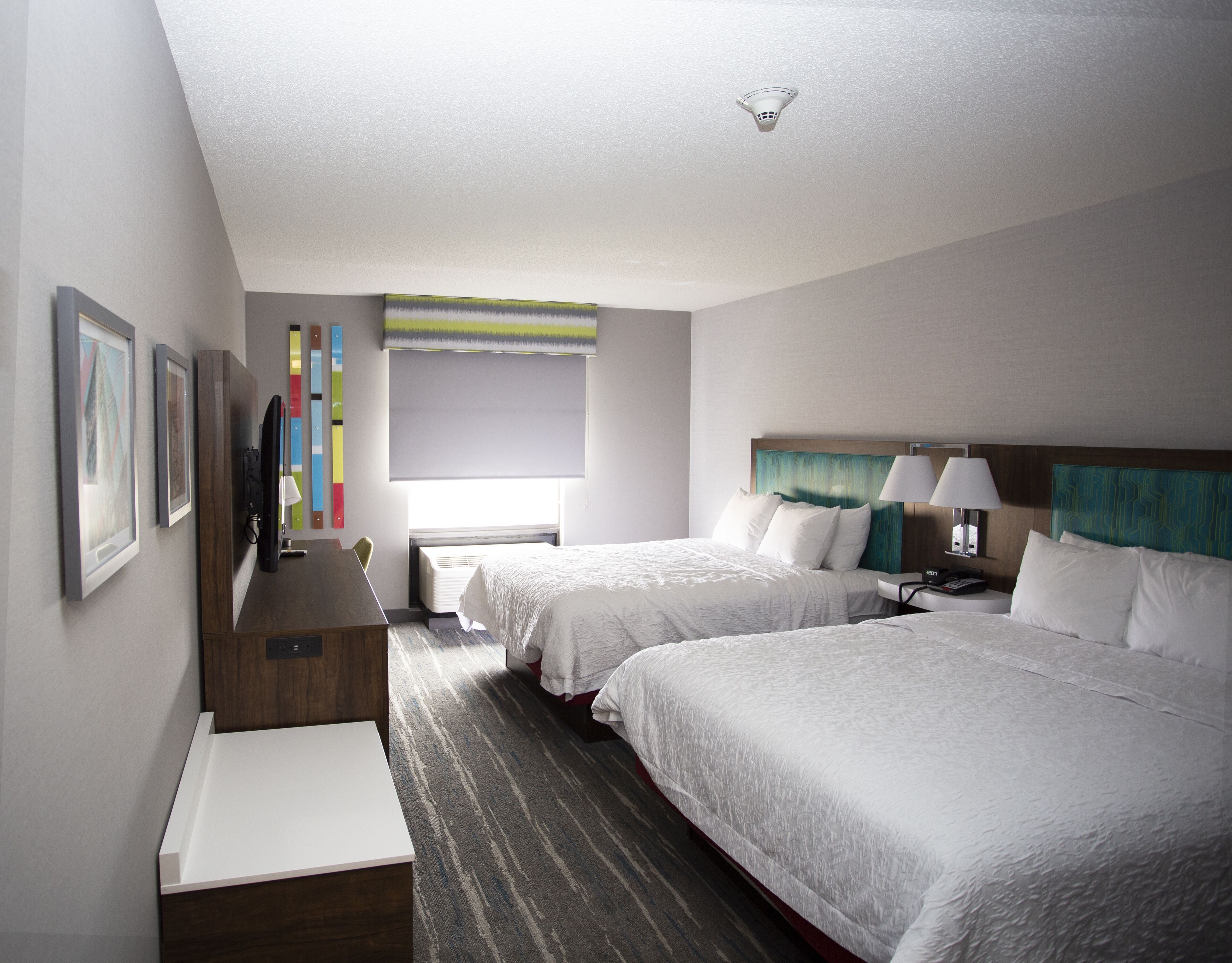 premium bedding, pillow-top beds, desk, laptop workspace