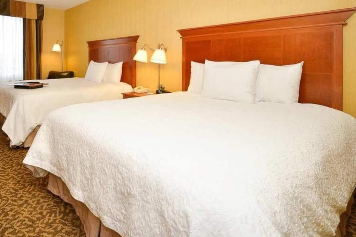 Premium bedding, pillow-top beds, desk, laptop workspace