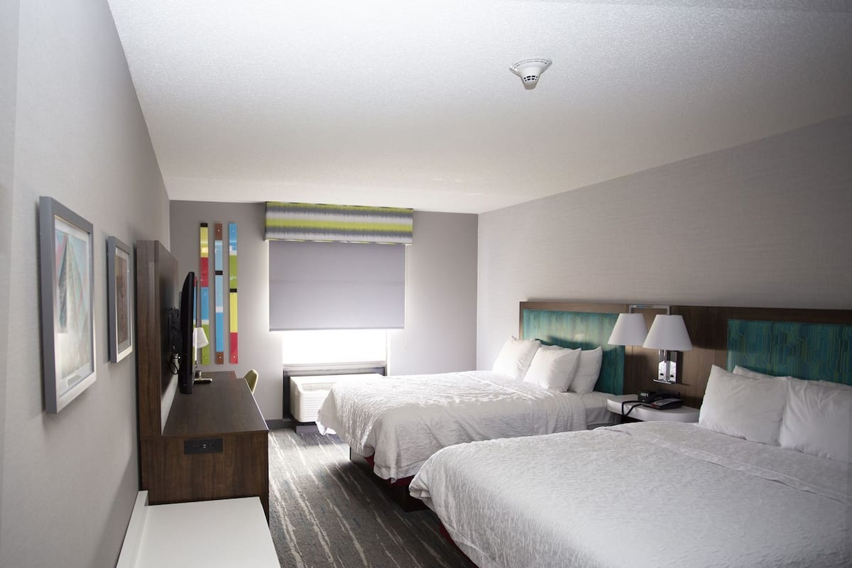 Premium bedding, pillow-top beds, desk, laptop workspace