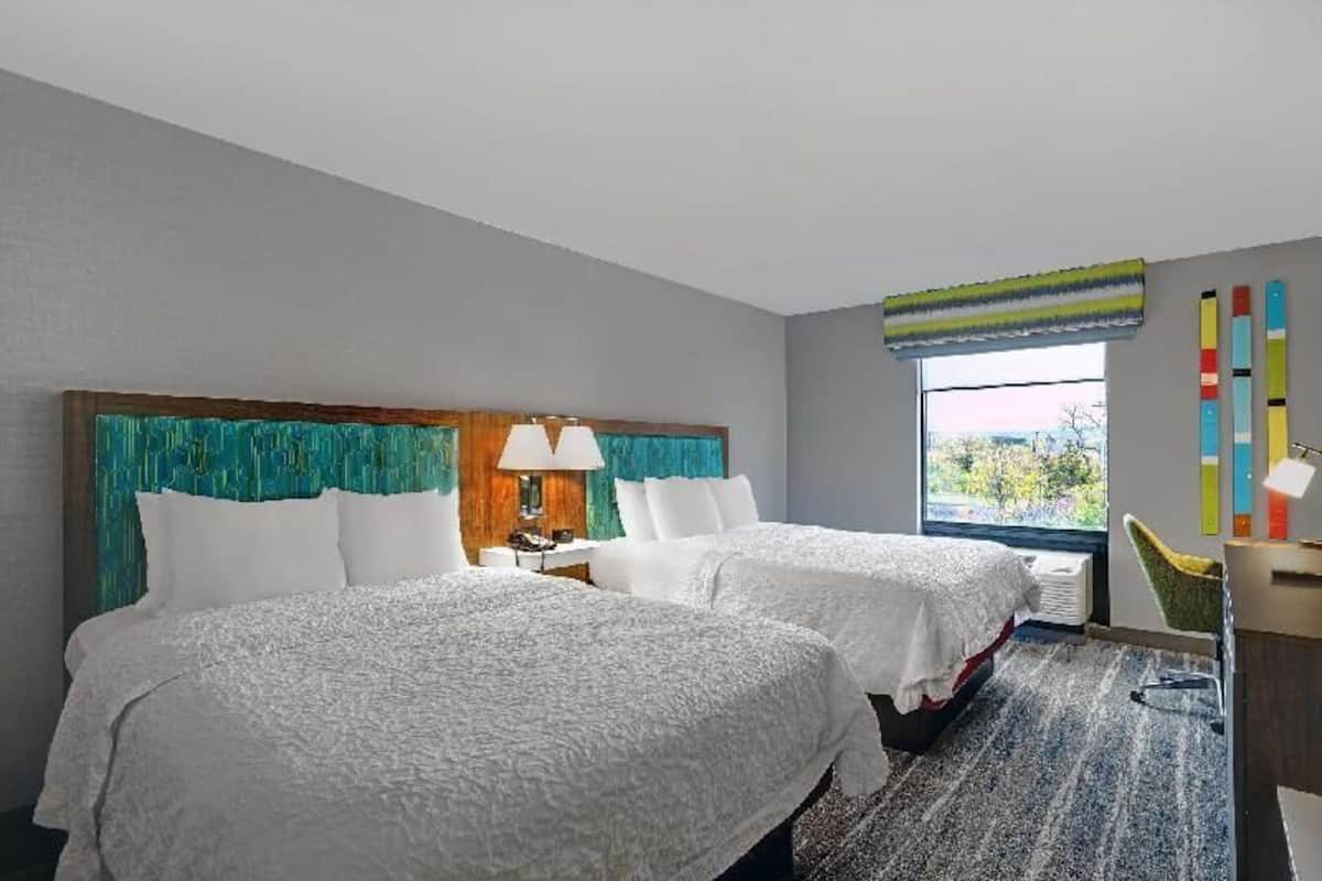 Premium bedding, pillow-top beds, desk, laptop workspace
