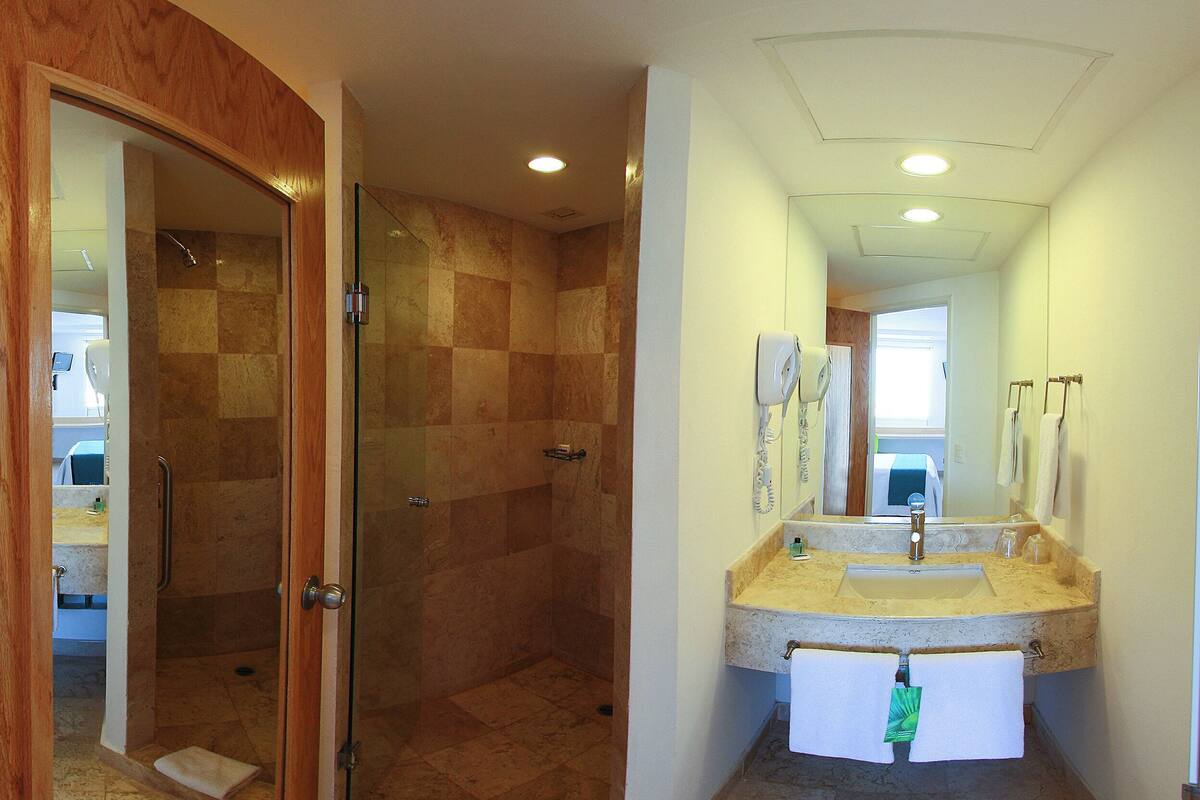 shower, eco-friendly toiletries, hair dryer, towels