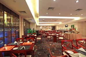 Enjoy a comfortable dining experience with a variety of seating options and beautifully set tables.