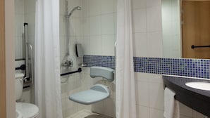 A bathroom with a toilet, a shower with a grab bar, a sink, and a mirror. - Holiday Inn Express Walsall M6J10 by IHG (Walsall)