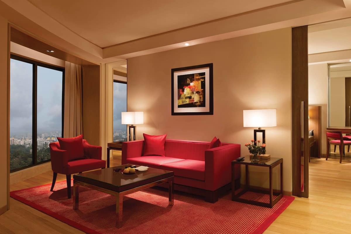 deluxe suite | living room | 32-inch lcd tv with satellite channels, tv, dvd player