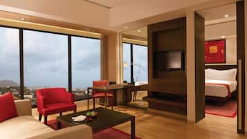 Club Suite | Living room | 32-inch LCD TV with satellite channels, TV, DVD player