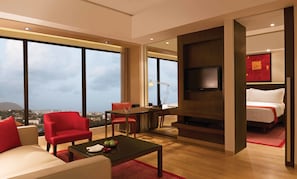 Club Suite | Living room | 32-inch LCD TV with satellite channels, TV, DVD player
