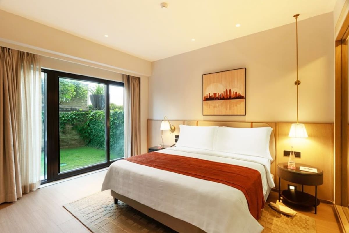 Club room, Patio | Premium bedding, down comforters, minibar, in-room safe