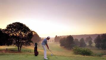 Golfers can enjoy a peaceful retreat amidst rolling hills and lush trees.