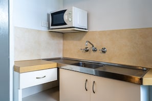 Family Studio (Ground Floor) | Private kitchenette | Fridge, microwave, coffee/tea maker, electric kettle