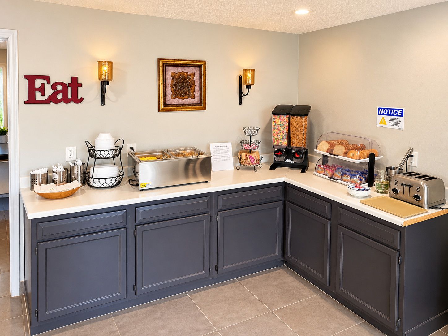 A breakfast bar with a variety of food options, a toaster, and a notice sign.