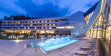 2 indoor pools, outdoor pool, open 8 AM to 10 PM, pool umbrellas