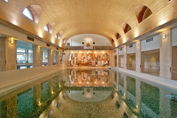 Indoor pool, outdoor pool, pool umbrellas, sun loungers