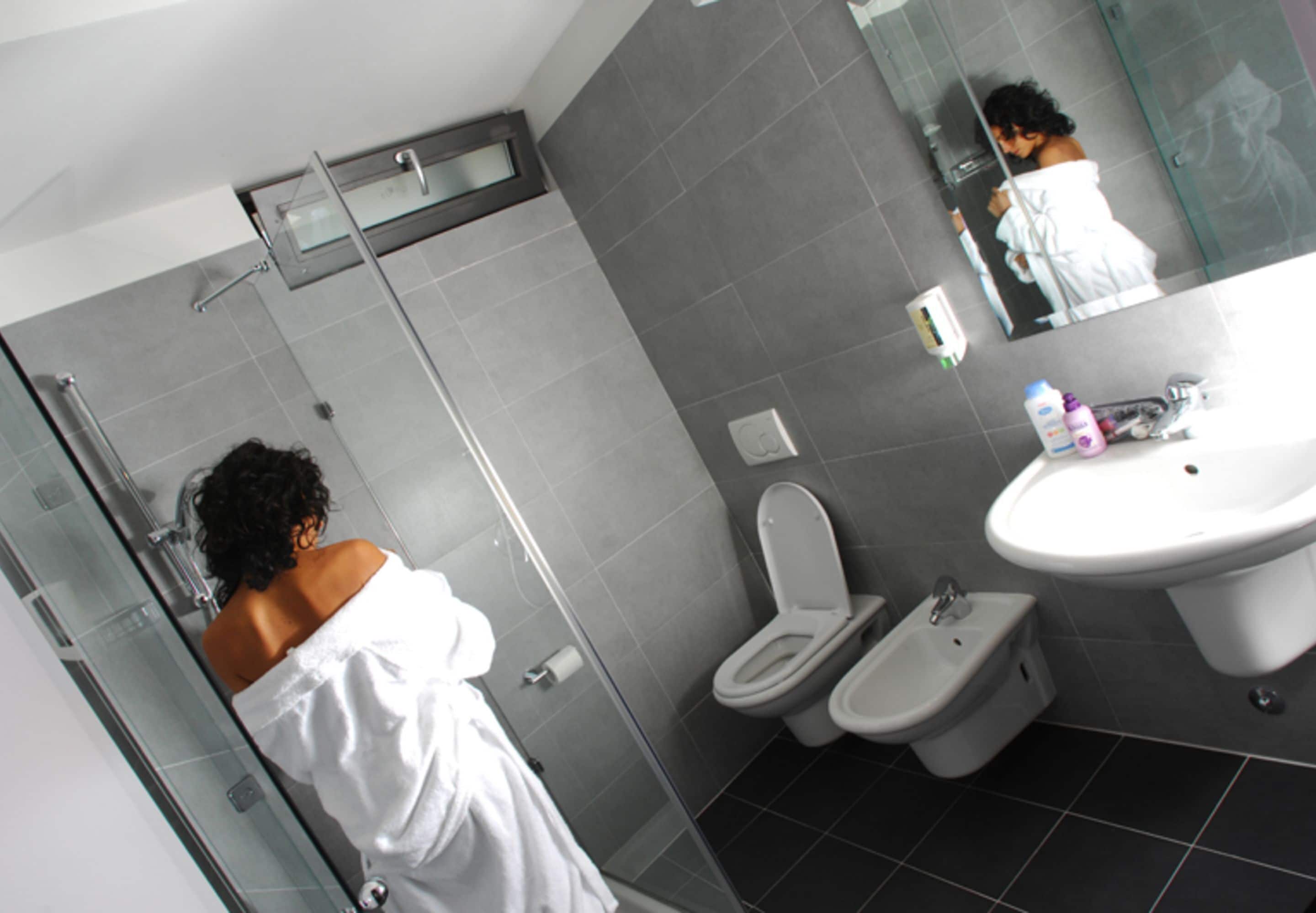 shower, hair dryer, bidet, towels