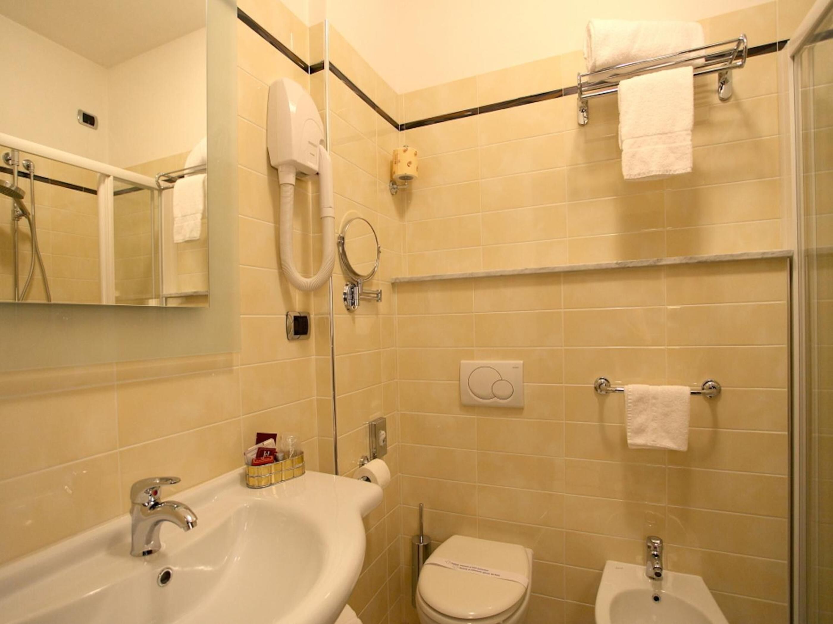 free toiletries, hair dryer, bidet, towels