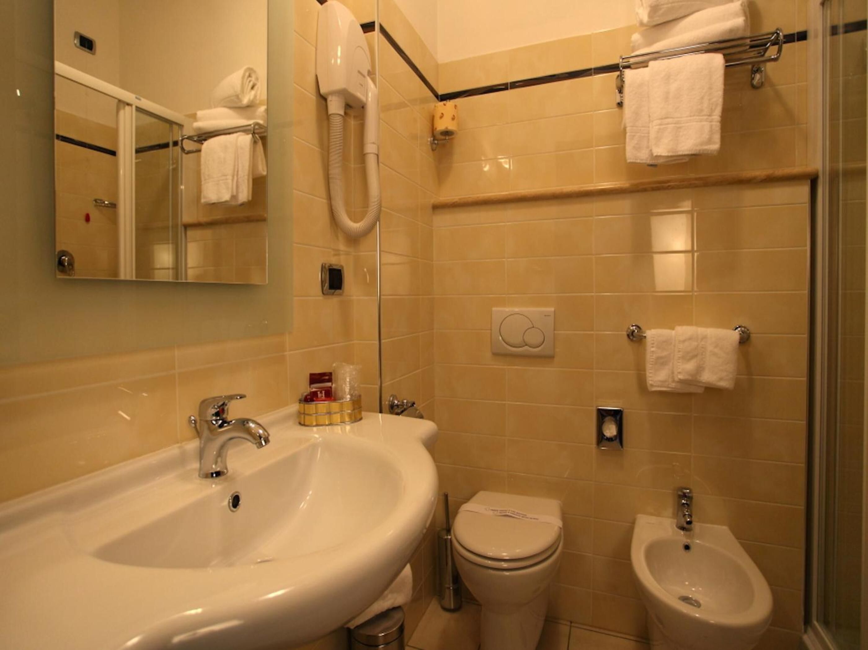 free toiletries, hair dryer, bidet, towels