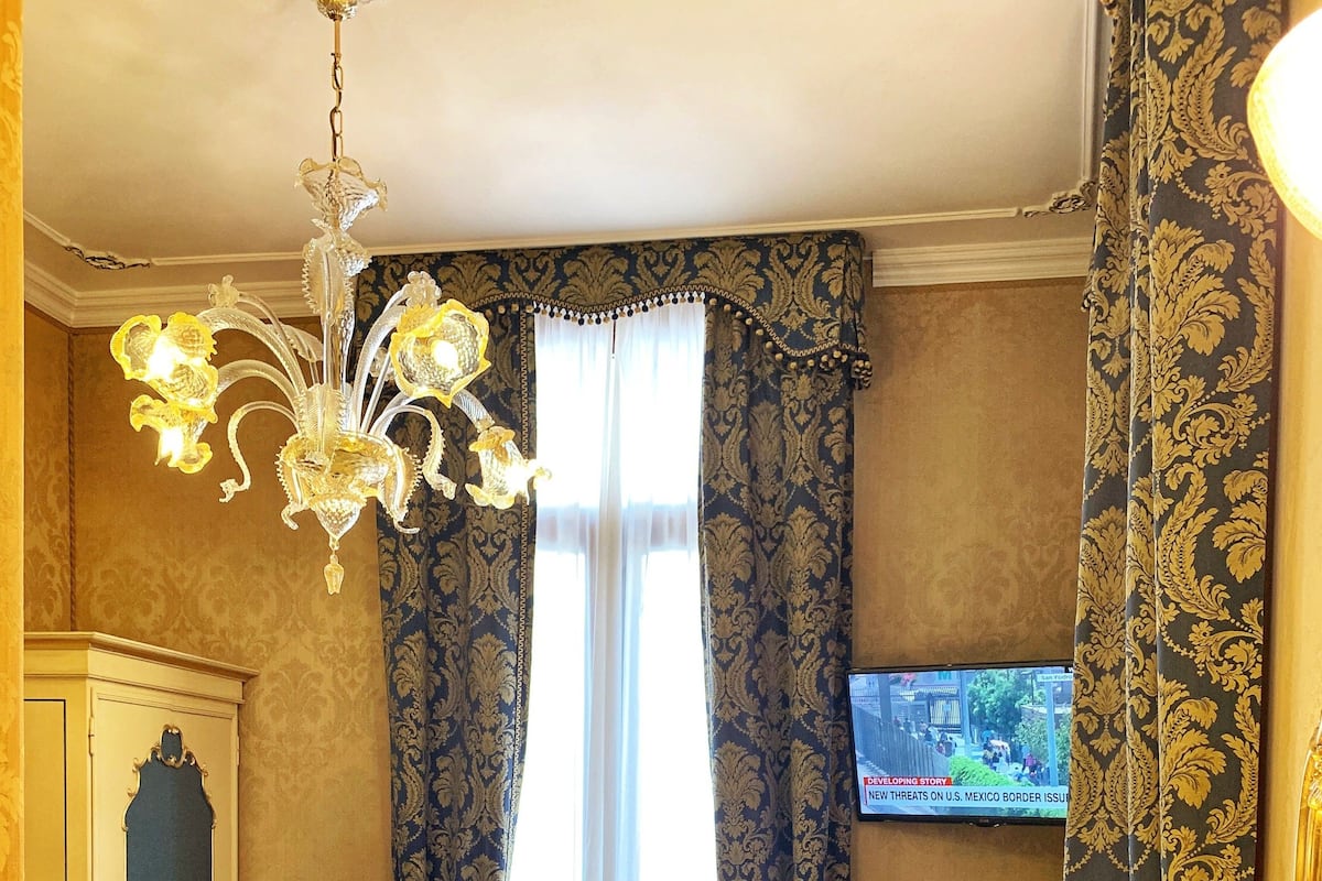 Classic Double Room, Balcony, Canal View | Minibar, in-room safe, desk, iron/ironing board