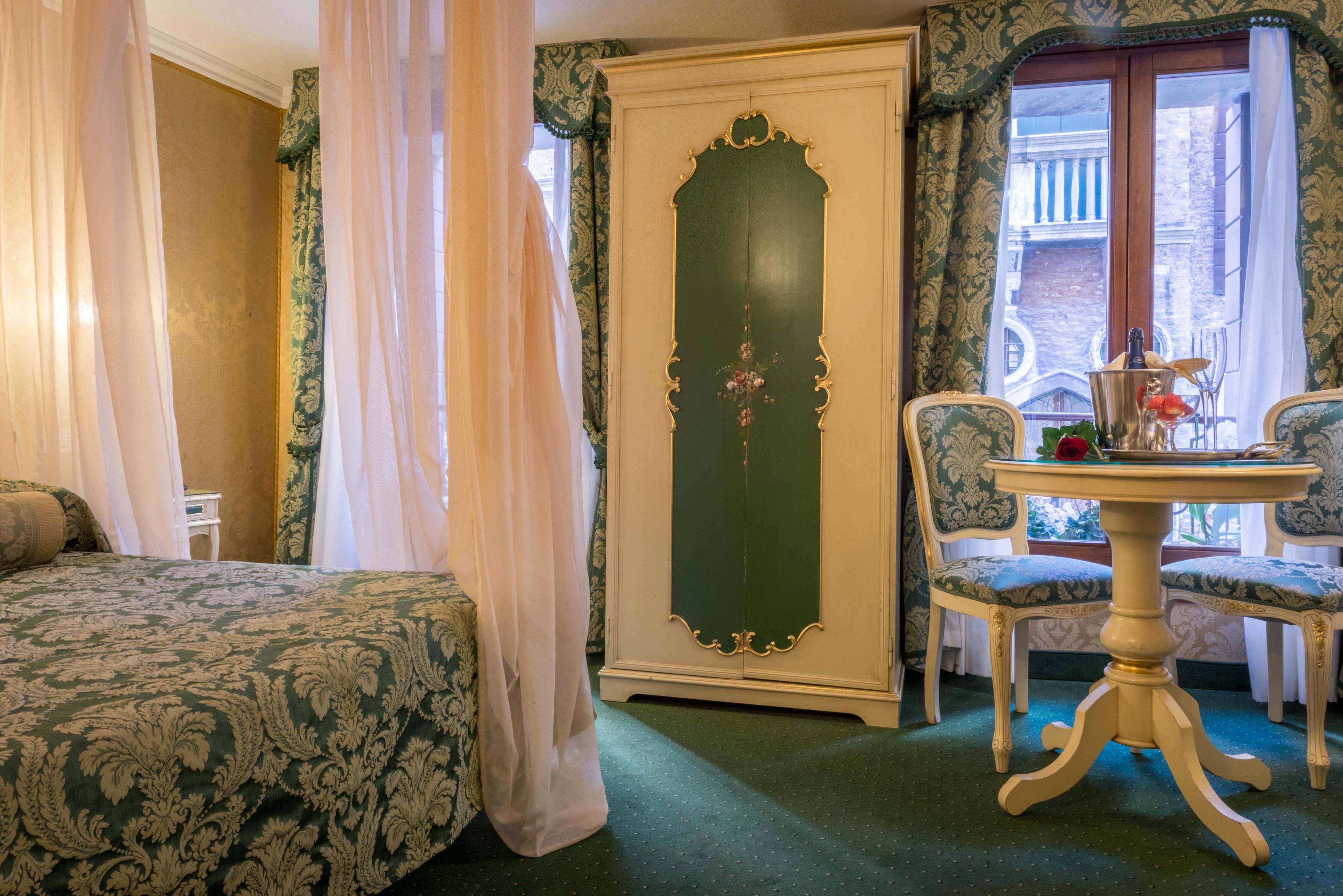 superior double room, canal view | minibar, in-room safe, desk, iron/ironing board