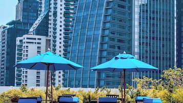 Outdoor pool, open 6:00 AM to 8:00 PM, pool umbrellas