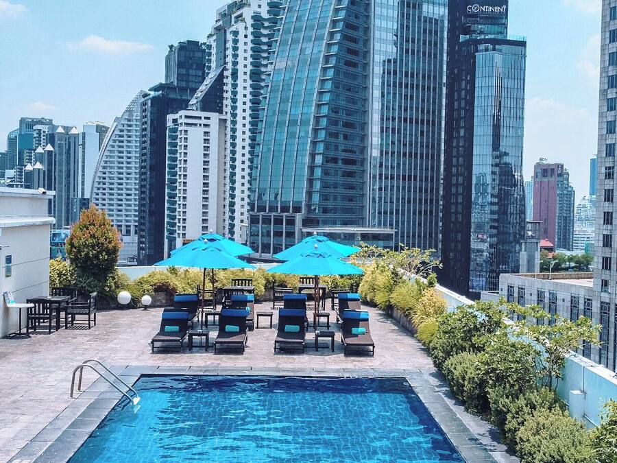 Outdoor pool, open 6:00 AM to 8:00 PM, pool umbrellas