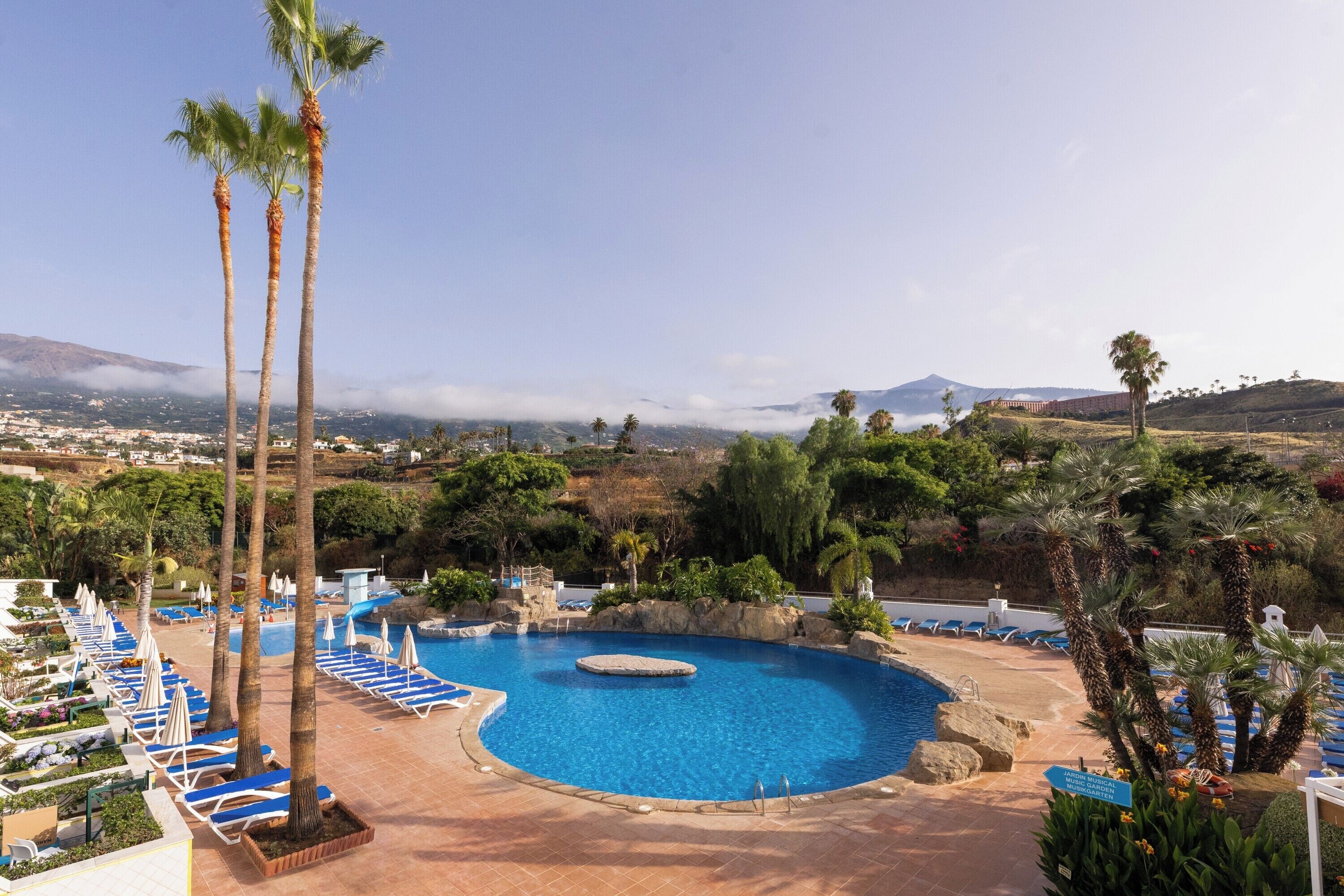 Outdoor pool, open 10 AM to 6 PM, pool umbrellas, pool loungers