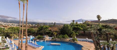 Outdoor pool, open 10 AM to 6 PM, pool umbrellas, pool loungers