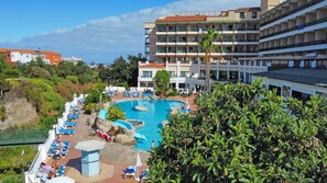 Outdoor pool, open 10 AM to 6 PM, pool umbrellas, pool loungers