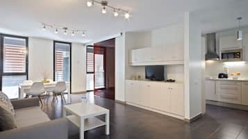 Apartment, 1 Bedroom | Living room | Flat-screen TV