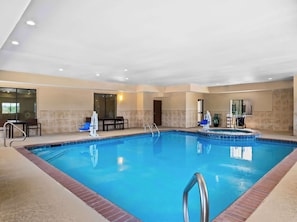 Indoor pool, open 9:00 AM to 9:00 PM, pool loungers