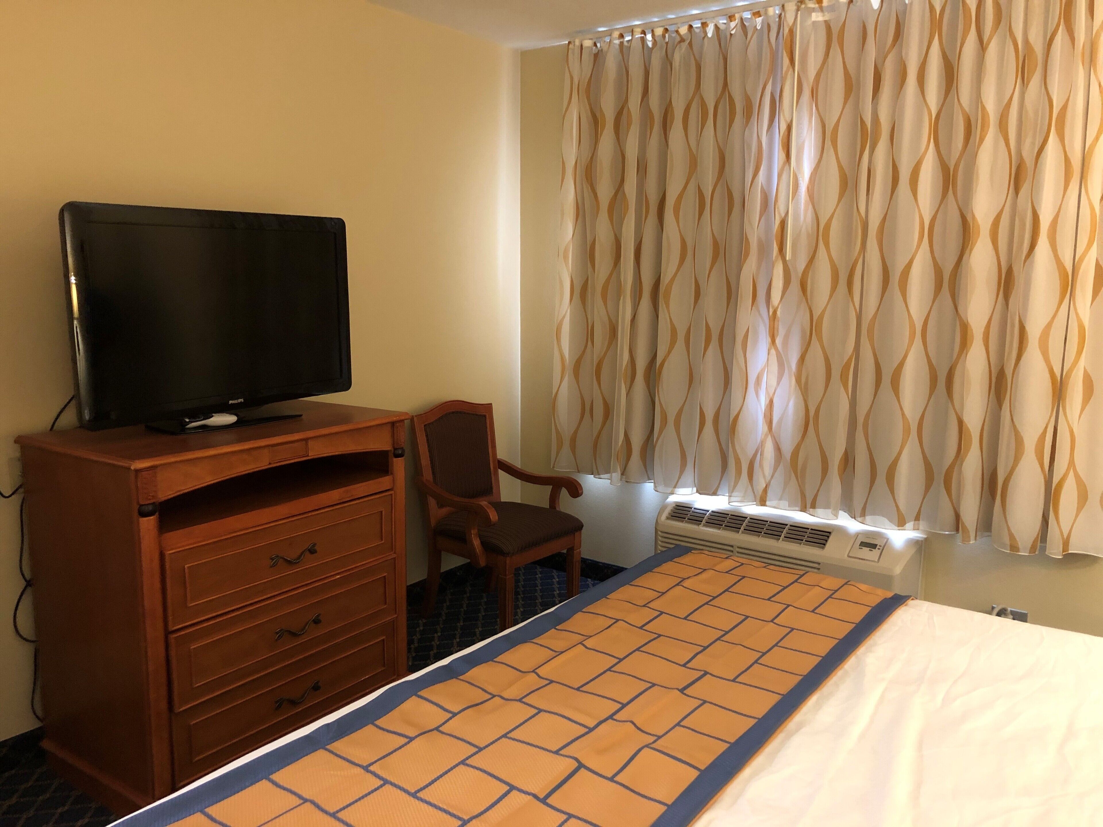 Desk, blackout drapes, iron/ironing board, free cribs/infant beds