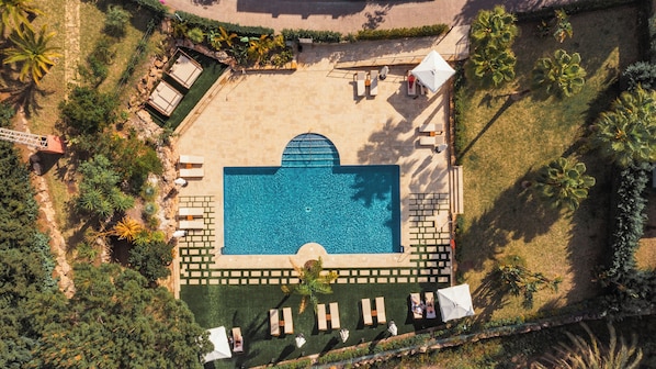 Outdoor pool, open 9:00 AM to 9:00 PM, pool umbrellas, pool loungers