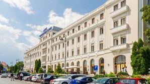 A large, historic building with multiple balconies and arched windows, likely a hotel or public building. - Continental Forum Sibiu (Sibiu)