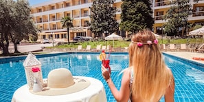 Indoor pool, outdoor pool, open 7:00 AM to 9:00 PM, pool umbrellas