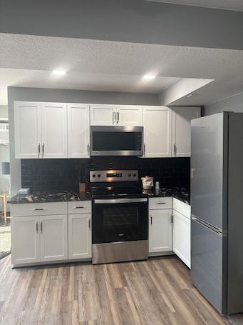 Luxury Suite | Private kitchen | Full-size fridge, microwave