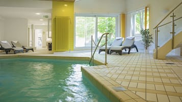 Indoor pool, open 7:00 AM to 9:00 PM, pool loungers